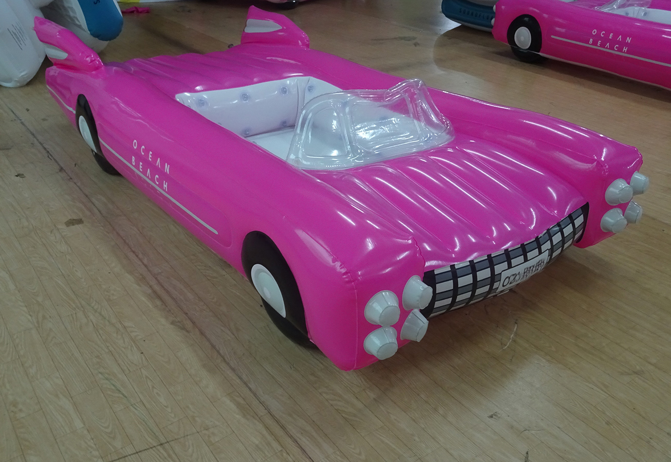 inflatable giant pink car float on beach pool 