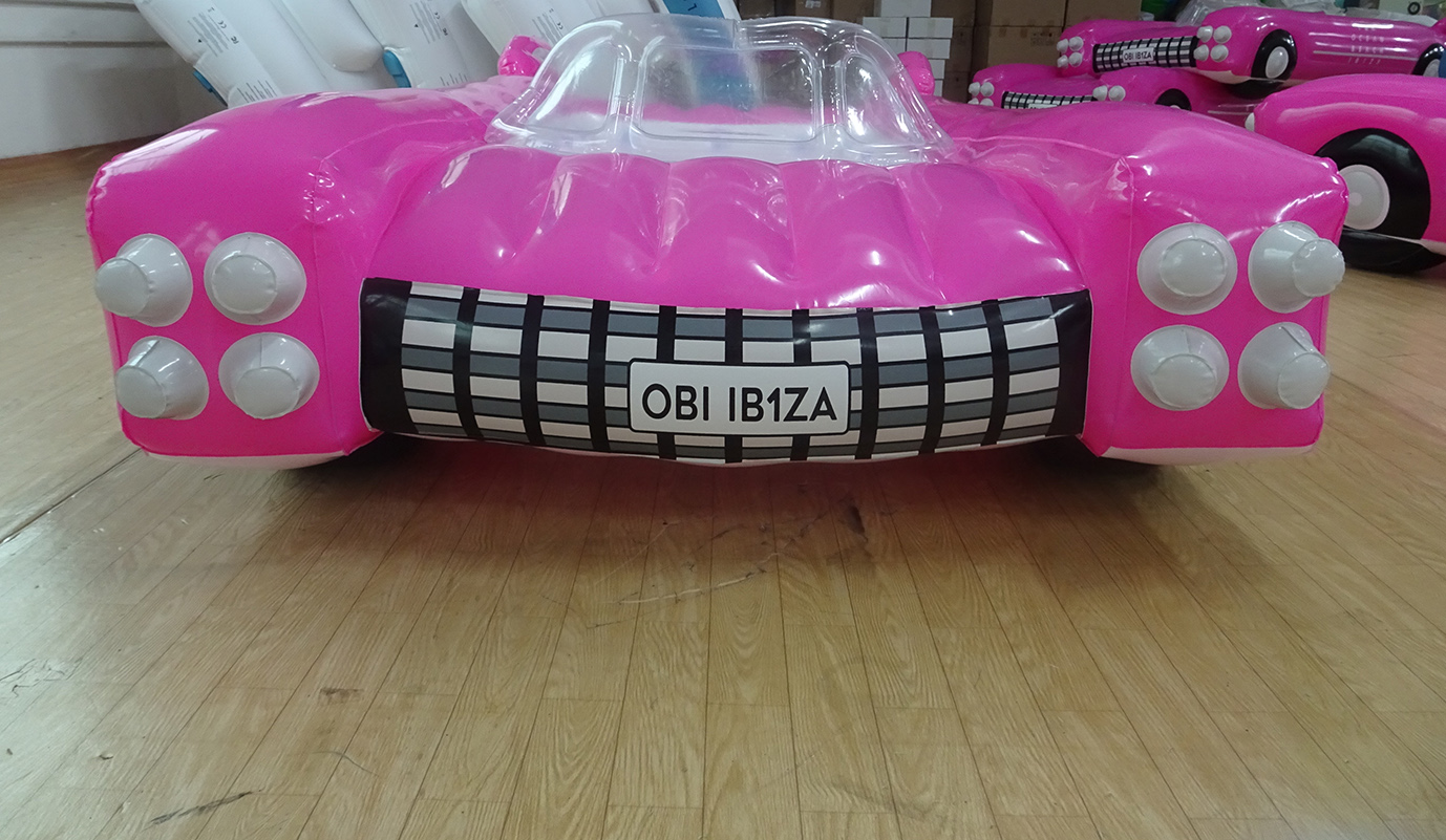 inflatable giant pink car float on beach pool 