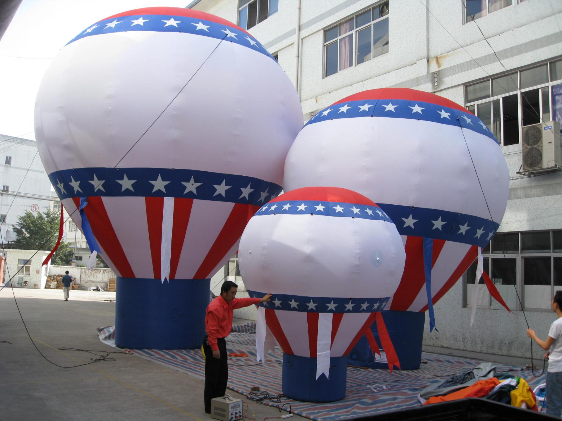 Inflatable big gound balloon with pump inside structure